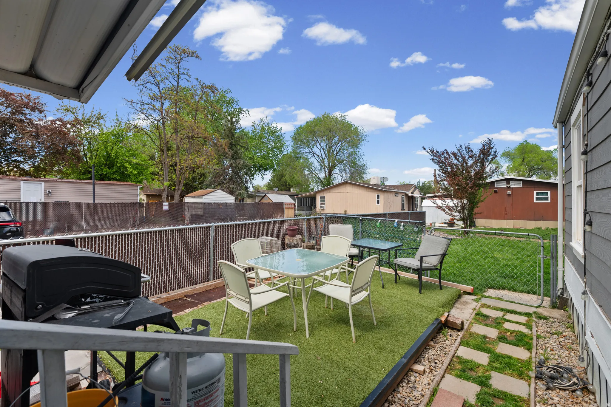 Fenced backyard featuring a patio and outdoor dining area
