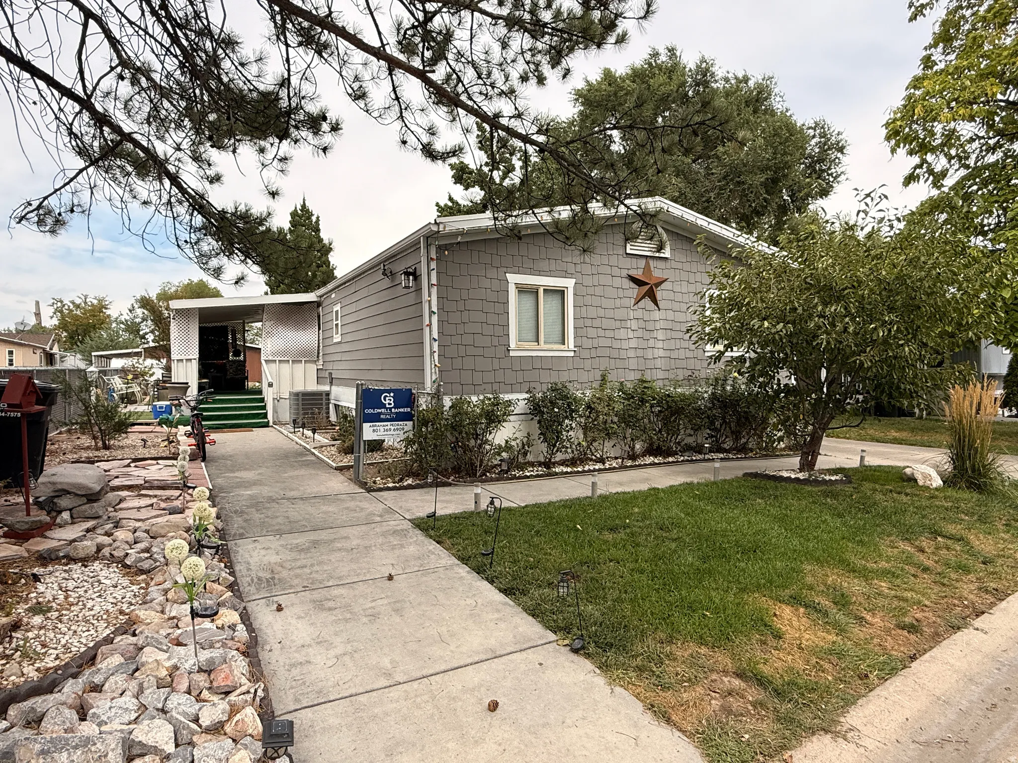 Gray shingle siding with white trim