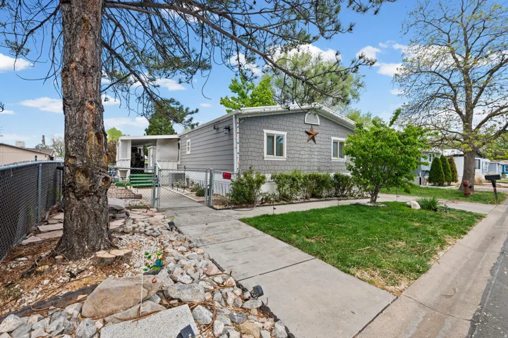 View of front of property featuring a gate and a fenced front yard