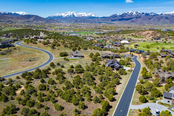 Aerial perspective of suburban area with a mountainous background