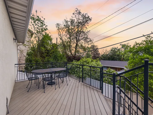 Deck at dusk with outdoor dining area