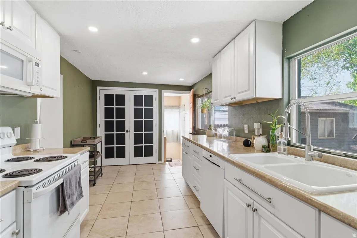 Kitchen featuring white appliances,