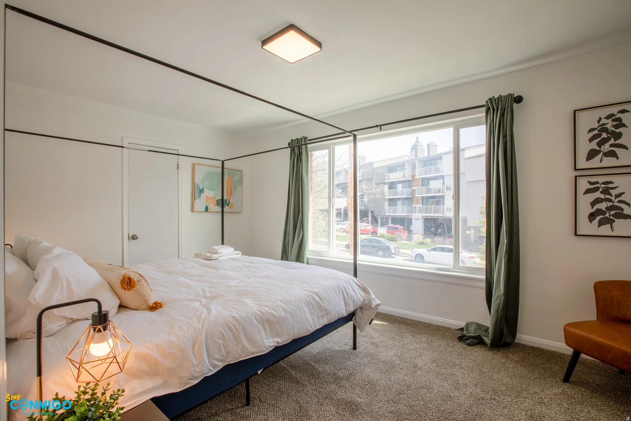 Bedroom featuring carpet floors and baseboards