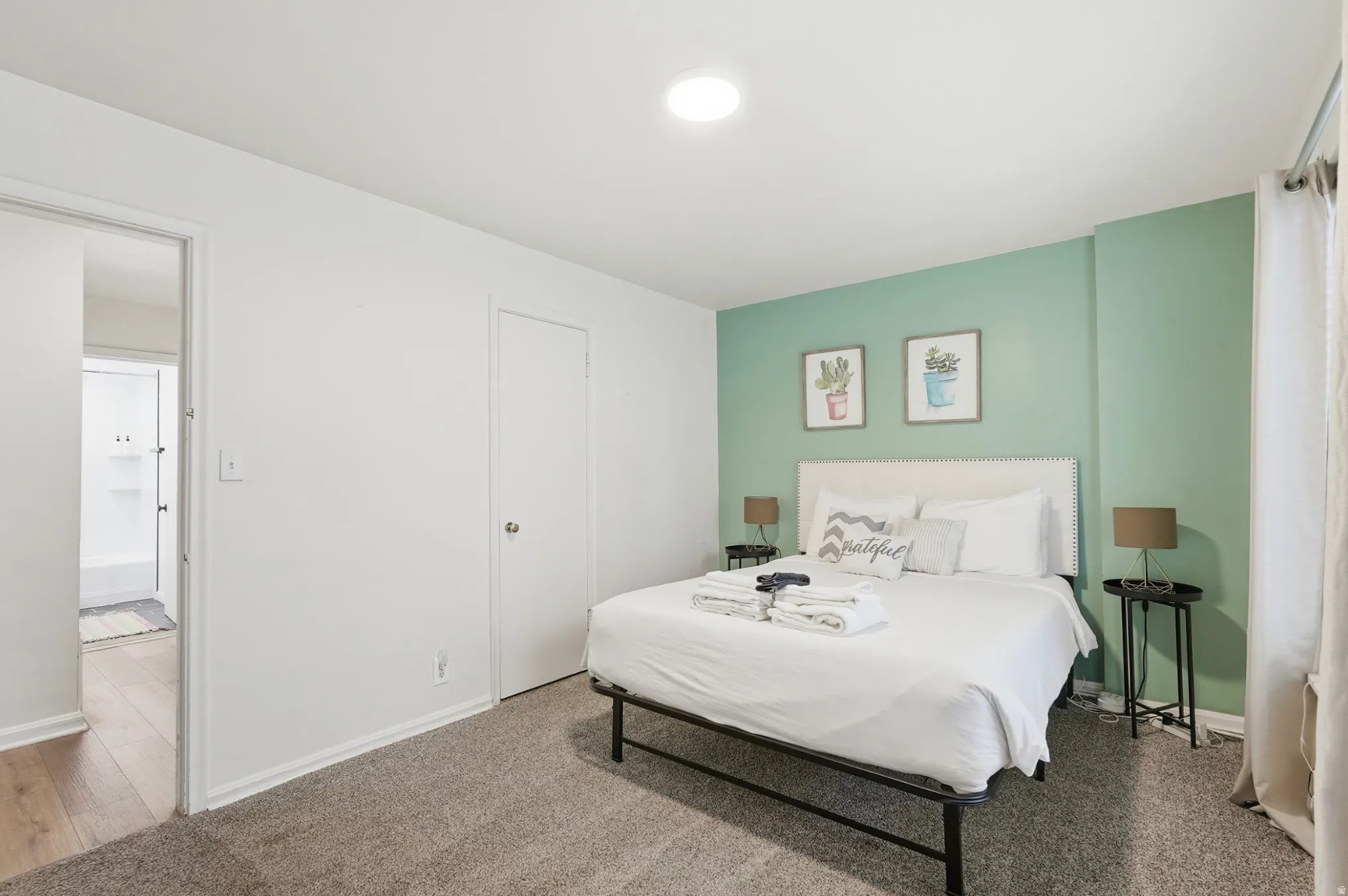 Carpeted bedroom with baseboards