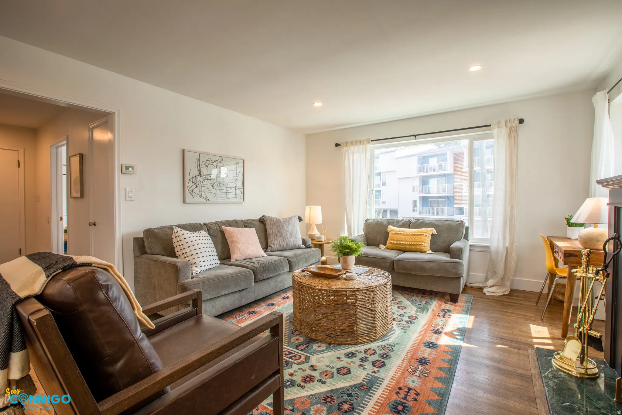 Living area featuring dark wood-style floors and recessed lighting