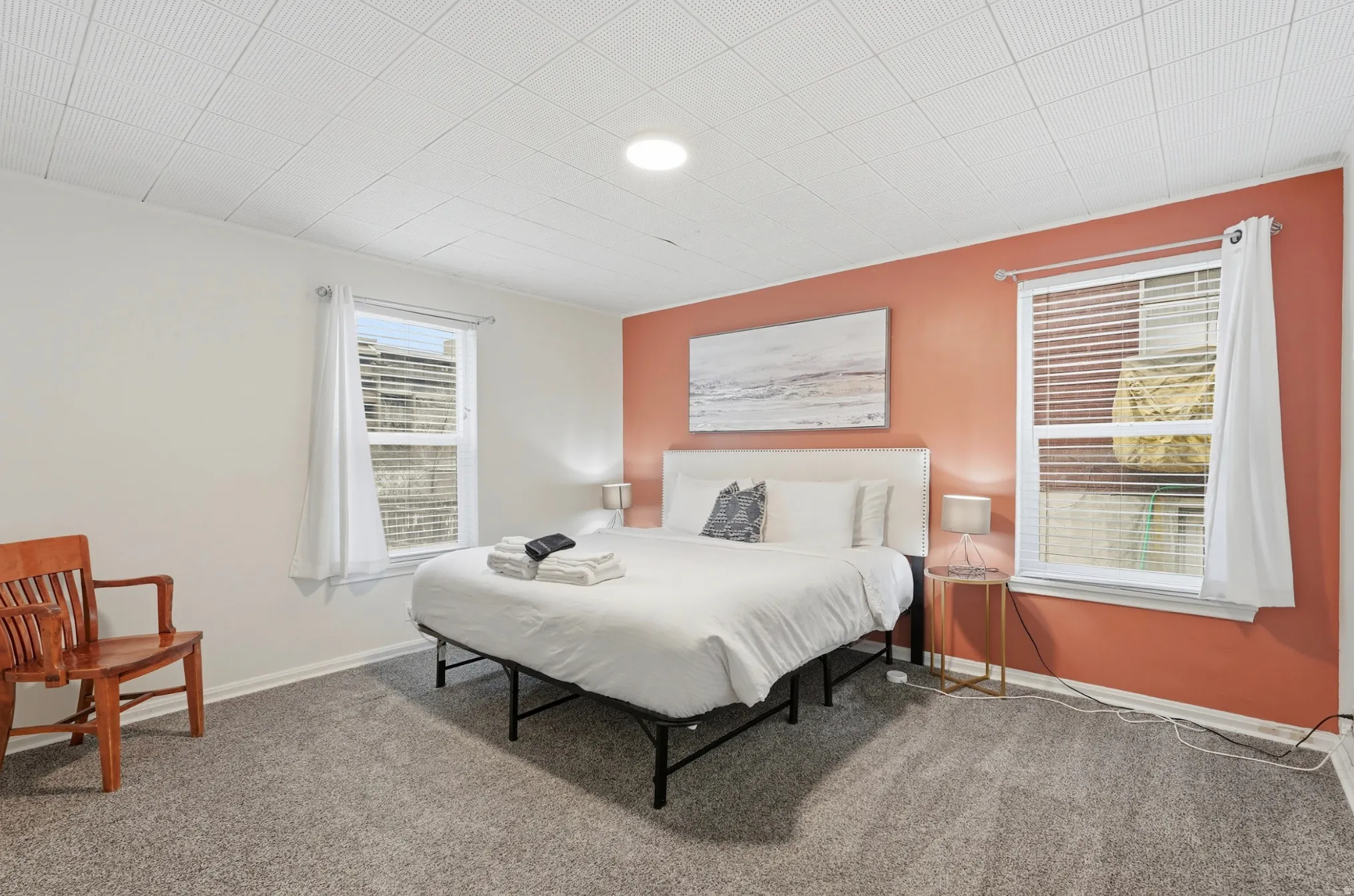 Carpeted bedroom featuring baseboards
