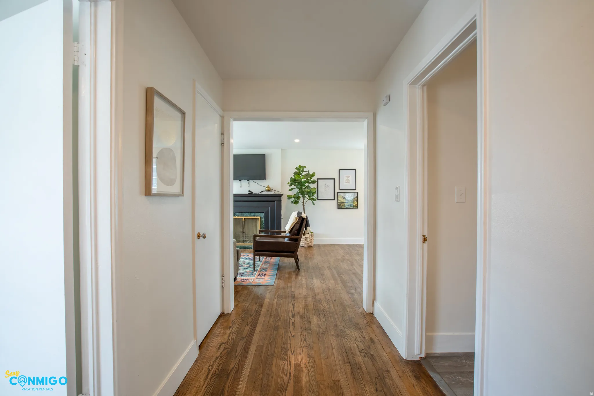 Corridor with dark wood finished floors and baseboards