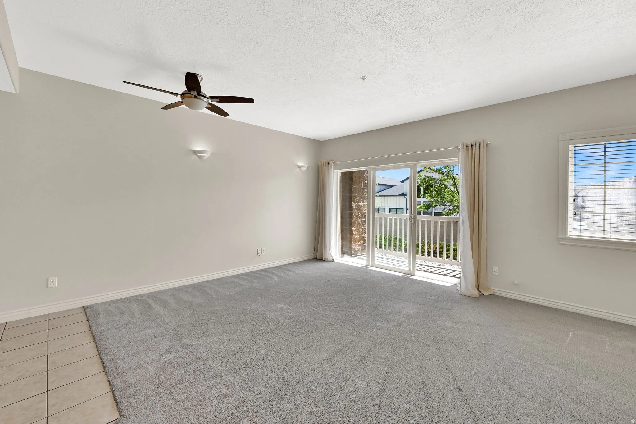 Living room and large slider to patio as seen from entry