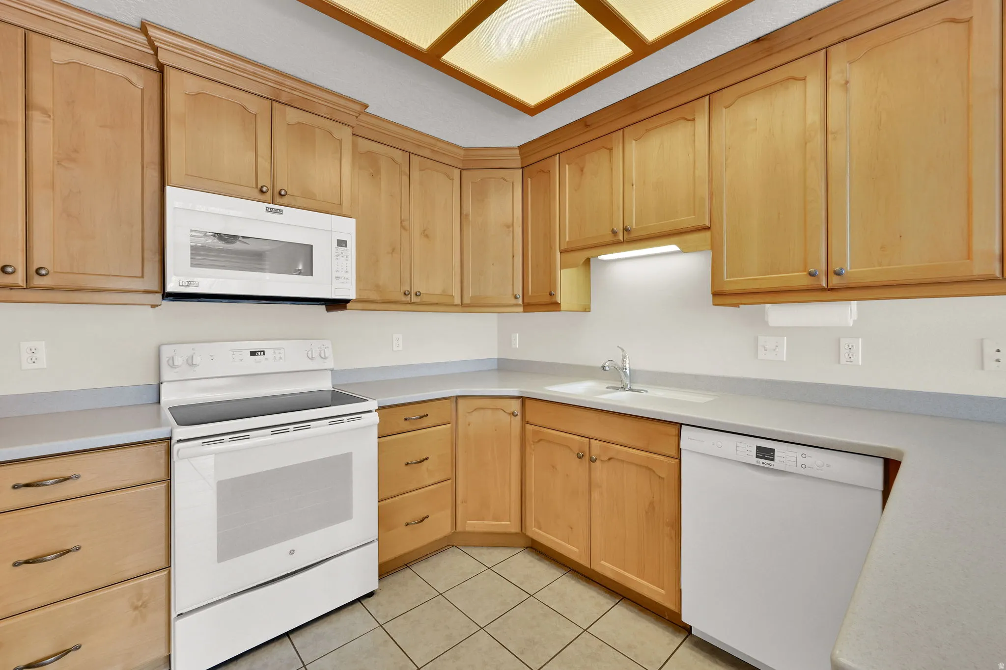 Clean, bright, kitchen with abundant storage