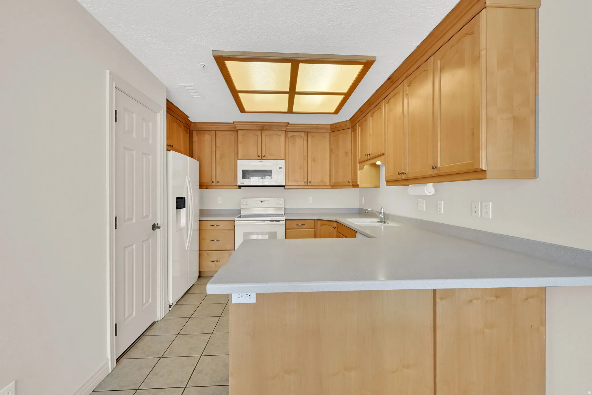 Ample countertop space for multiple cooks, and a breakfast bar for the grandkids.
