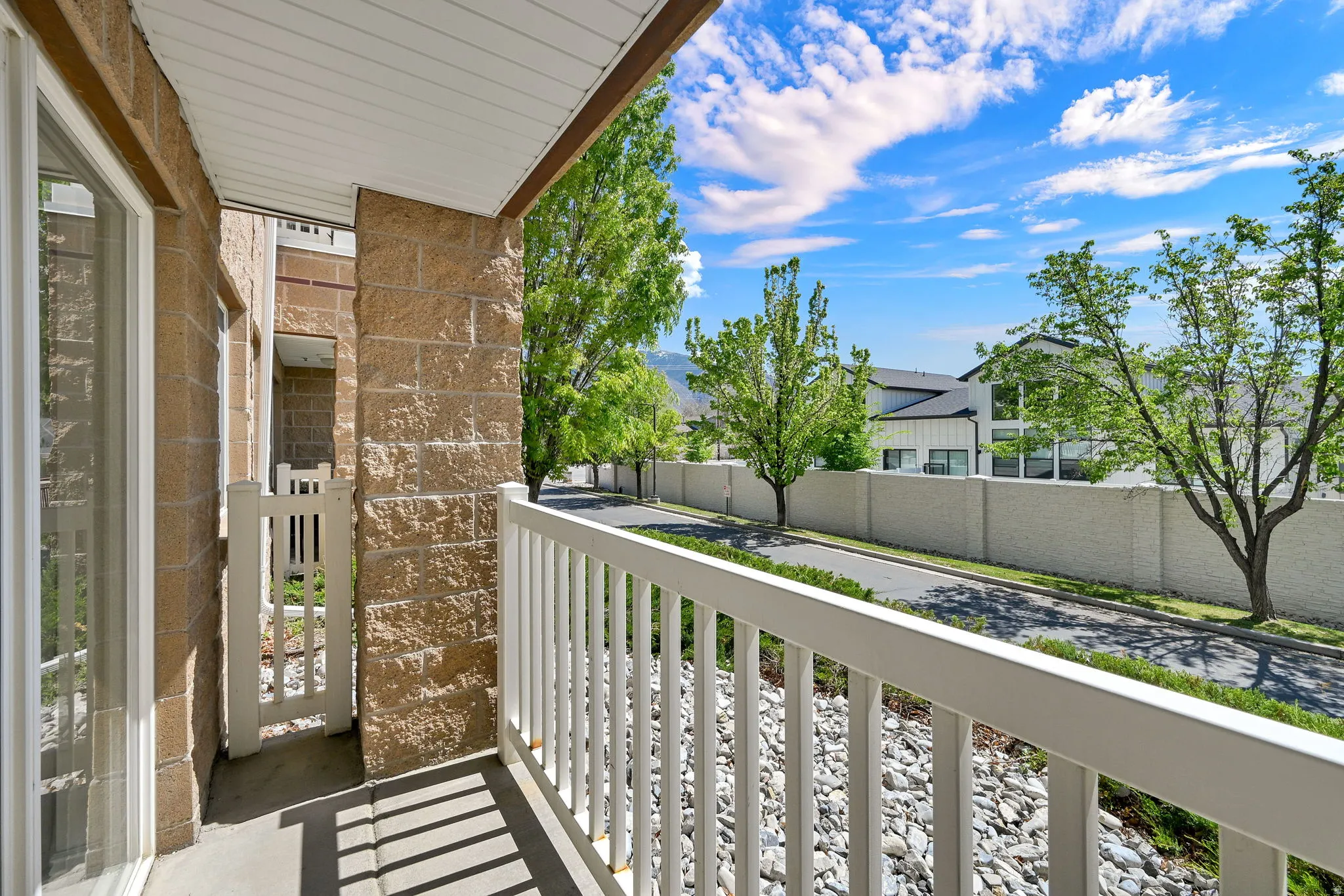 Cute covered balcony off living room looking southeast east