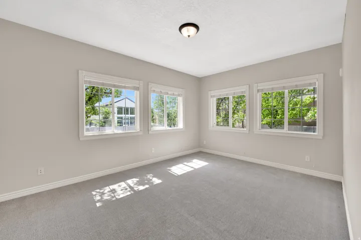 Bedroom two, on southeast corner of building, is spacious, cheery, and bright