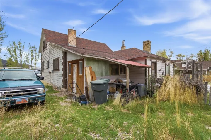 View of side of property featuring a chimney