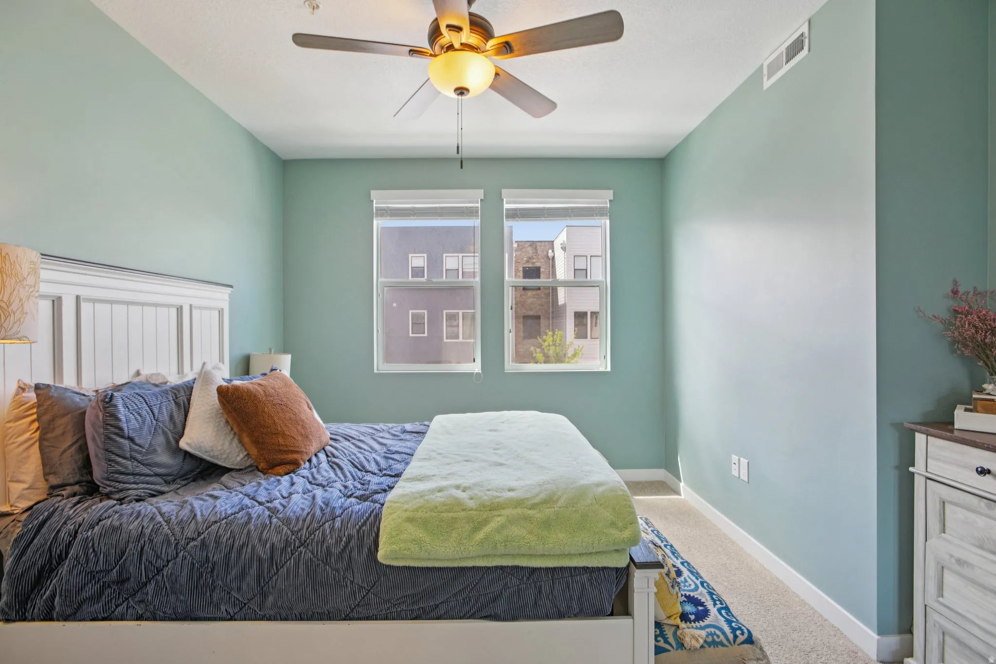 Bedroom with carpet floors and a ceiling fan