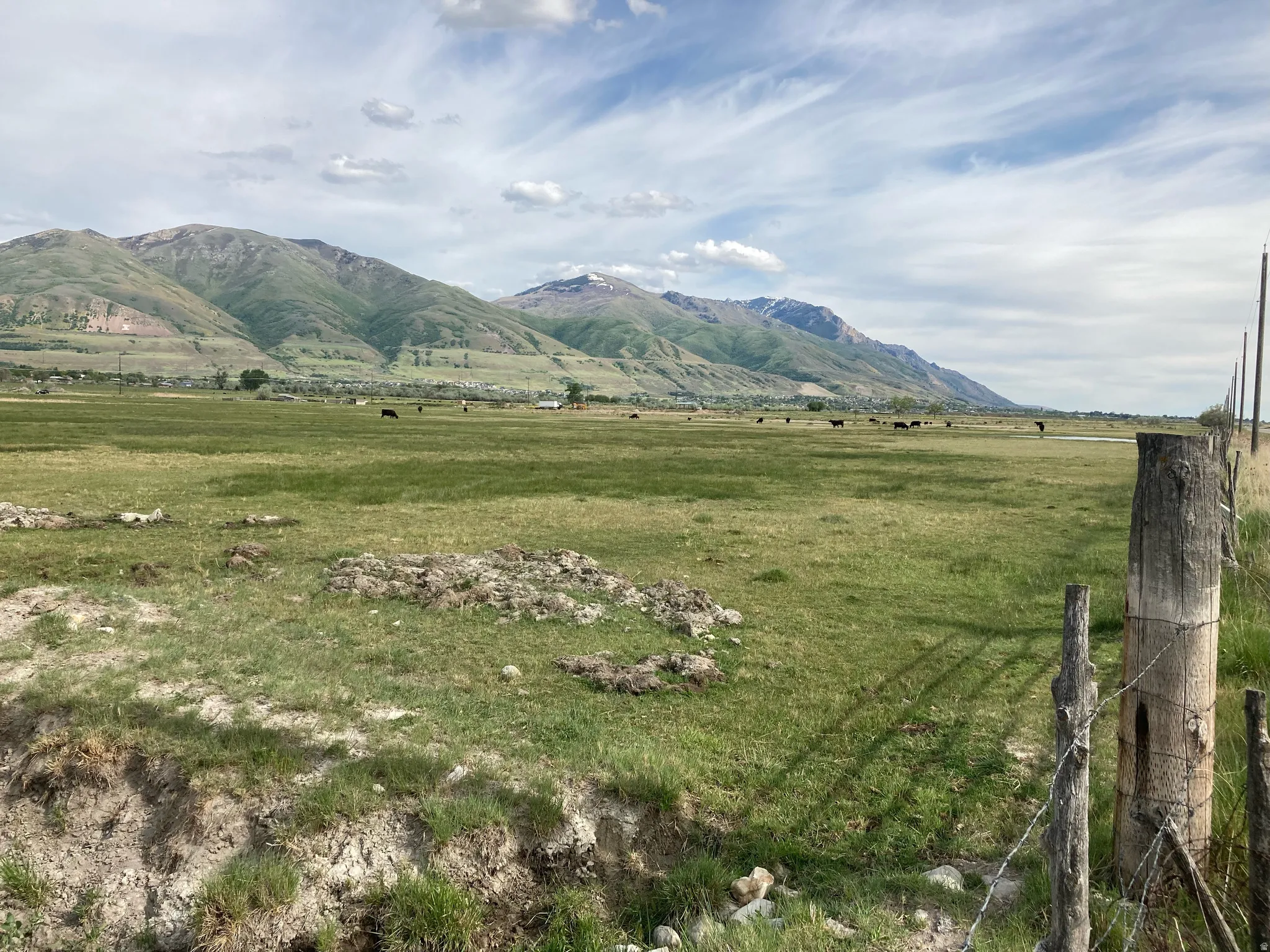 View of mountain backdrop with rural landscape