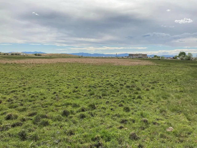 View of yard featuring a view of countryside and a mountain view