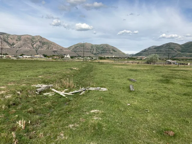View of mountain backdrop featuring rural landscape