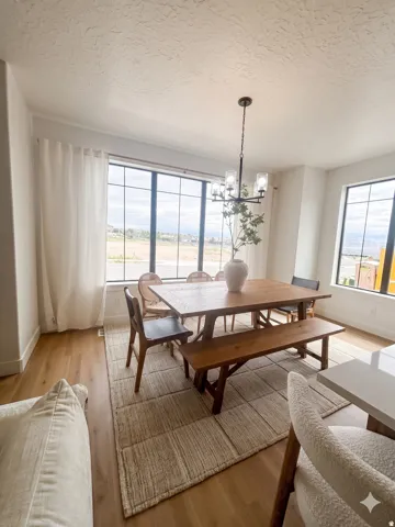 Dining space with wood-finish flooring