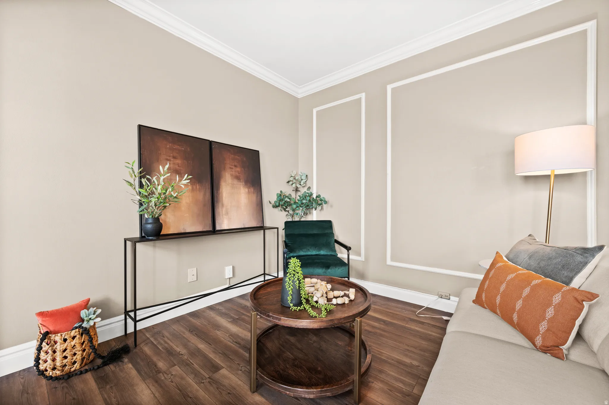 Living area featuring ornamental molding and wood finished floors
