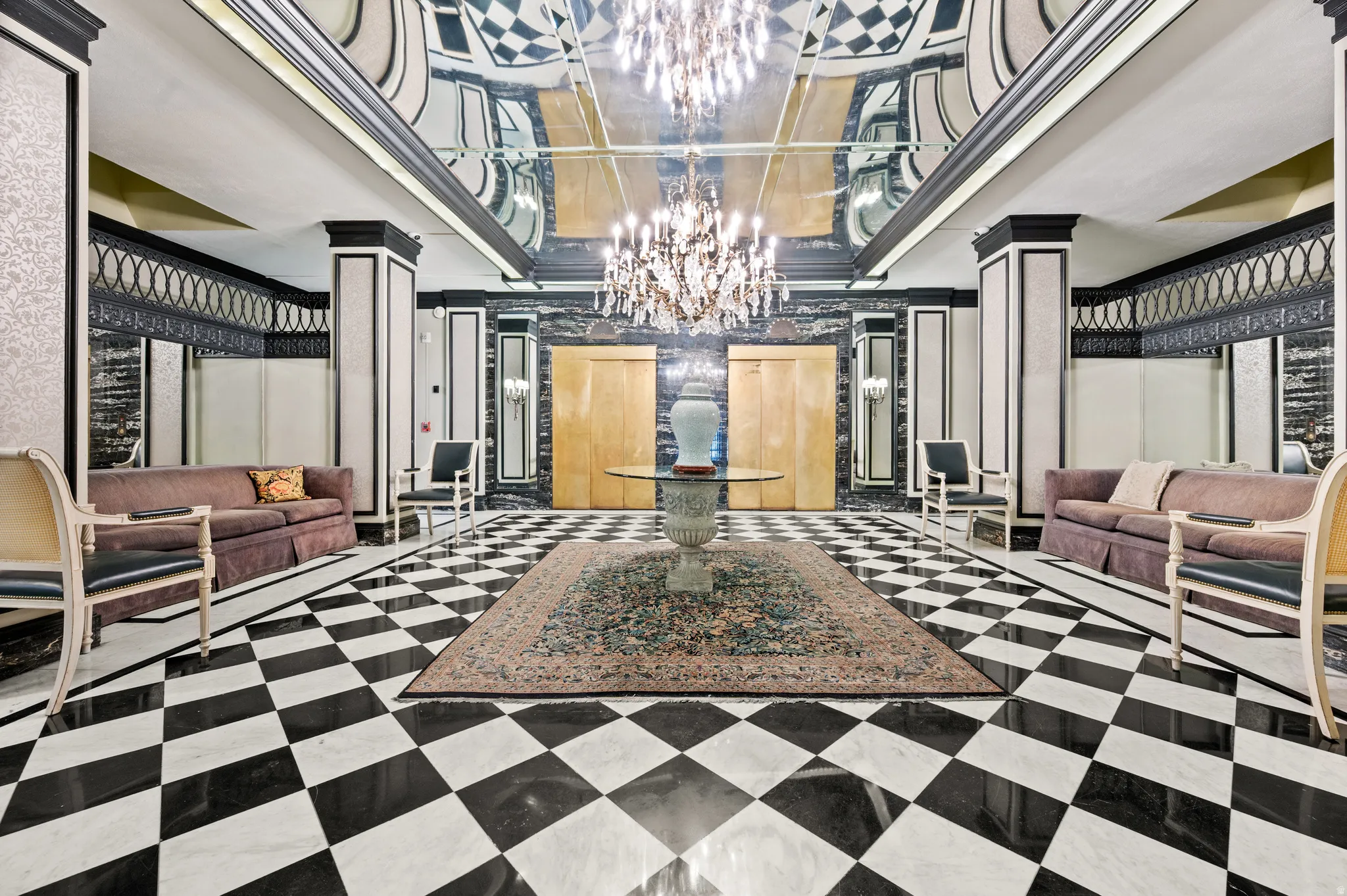 Building lobby featuring crown molding and a decorative wall