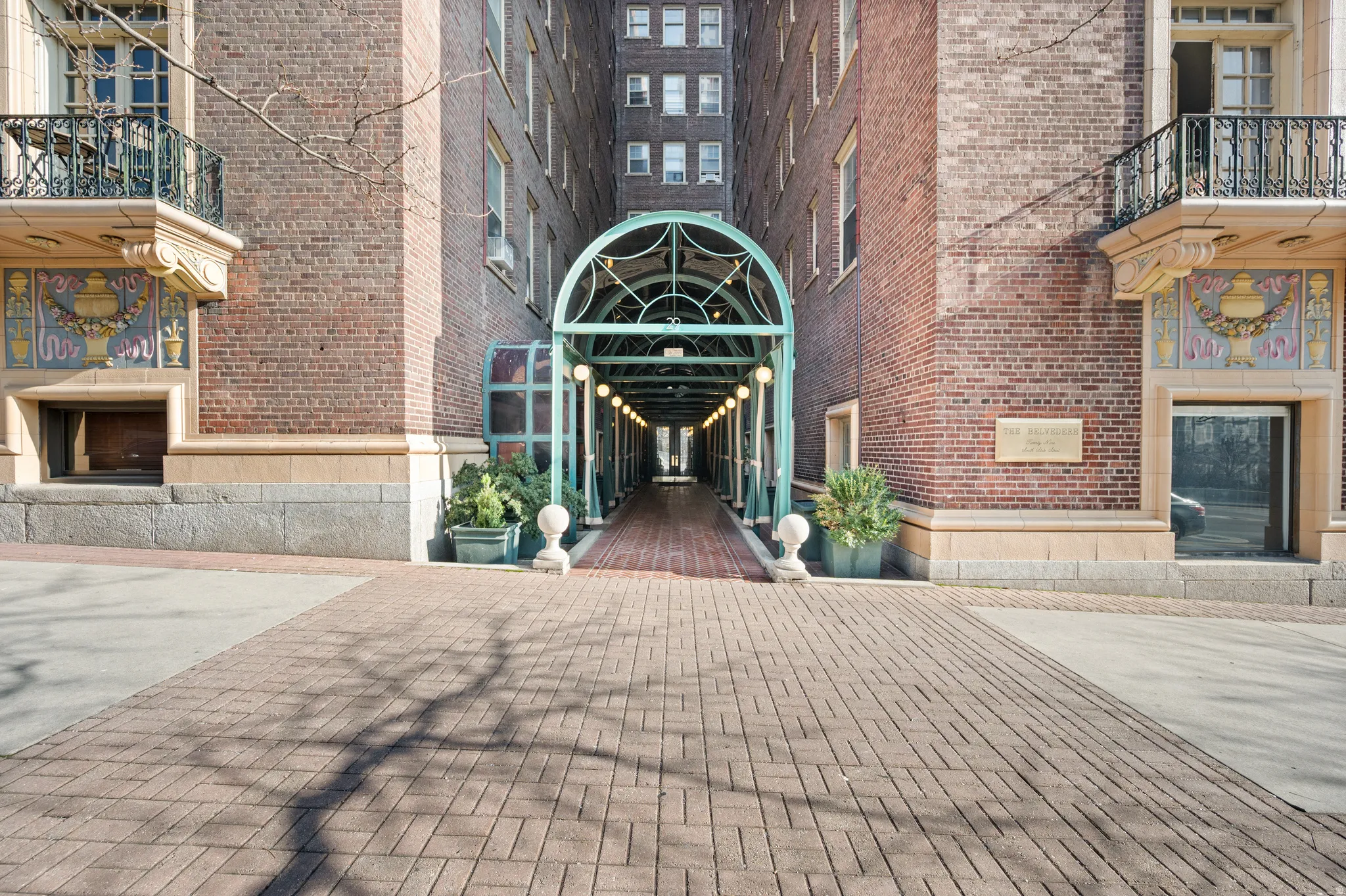 Entrance to property featuring brick siding