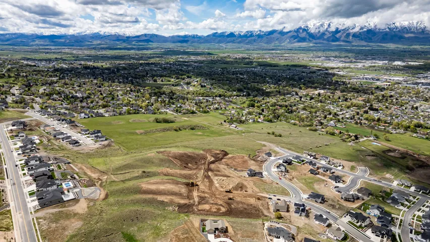 Aerial view of residential area featuring a mountainous background