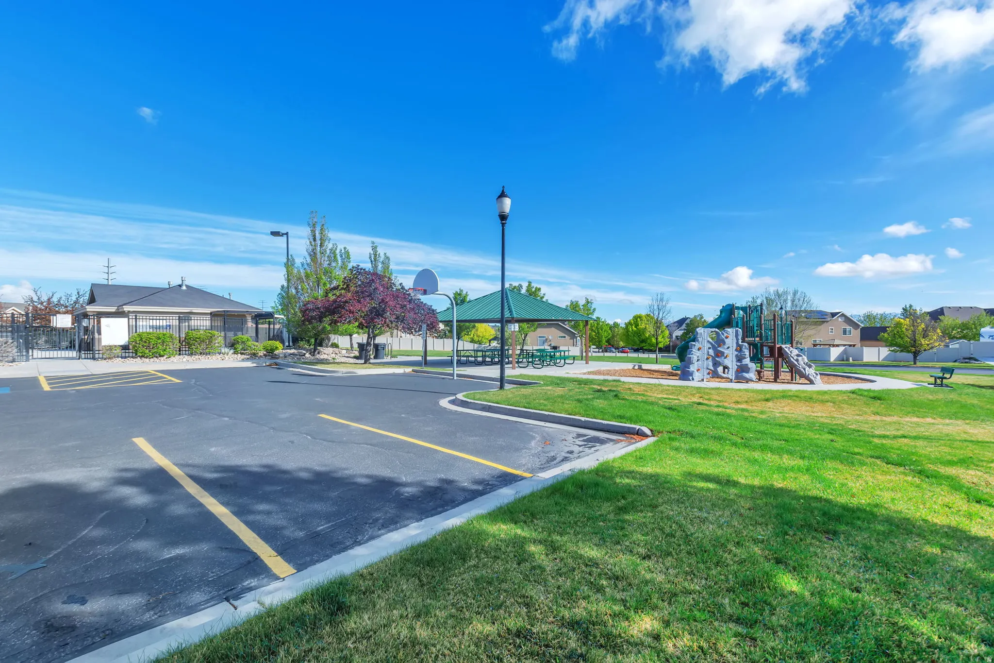View of asphalt road with curbs and a residential view