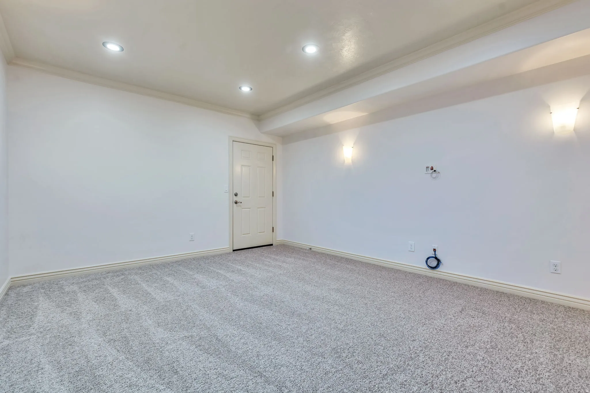 Unfurnished room with crown molding, light carpet, and recessed lighting