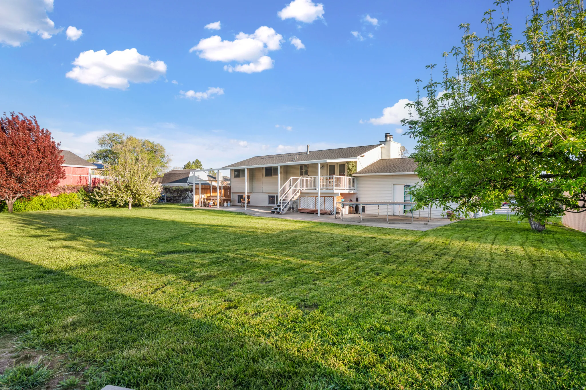 Back of property with a patio and a chimney