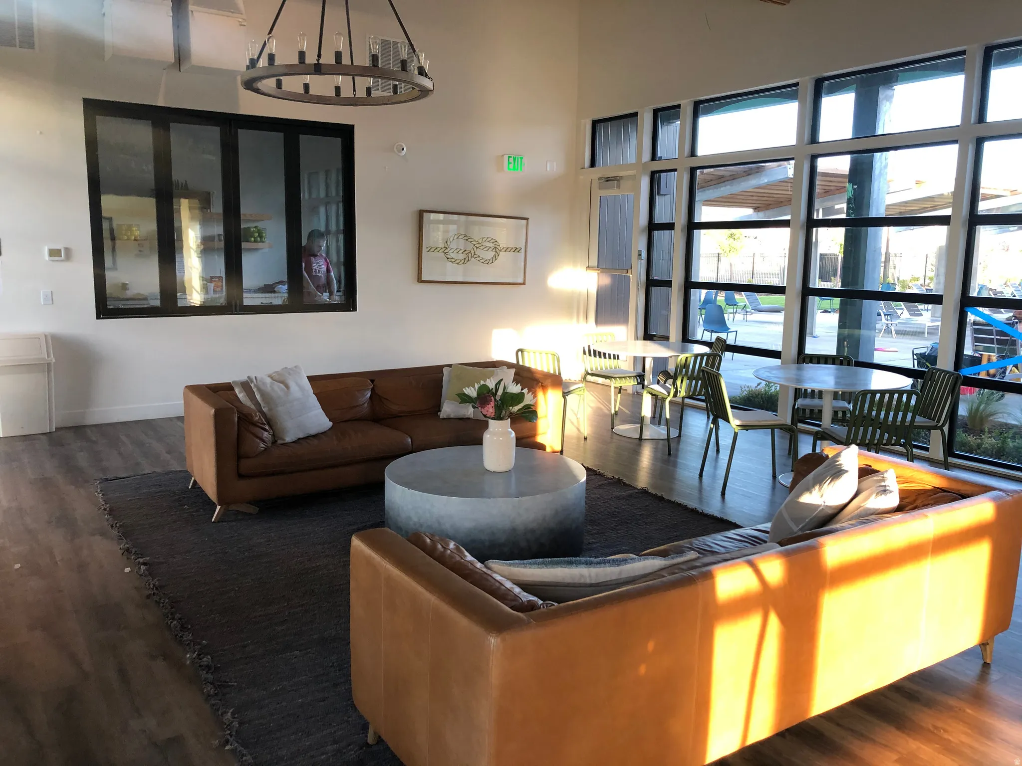 Living area featuring dark wood-style floors and baseboards