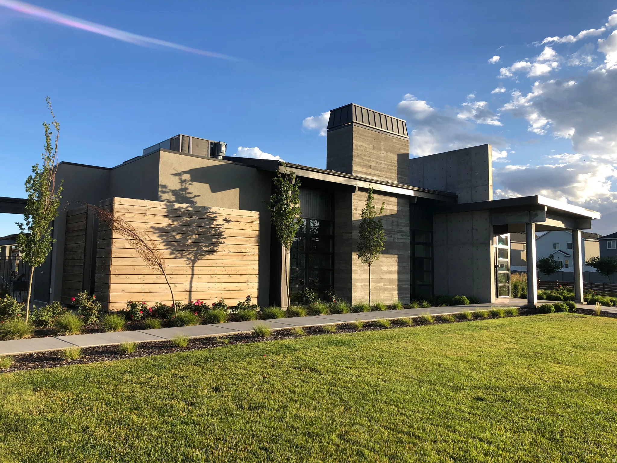 View of front of house featuring a front yard and a chimney