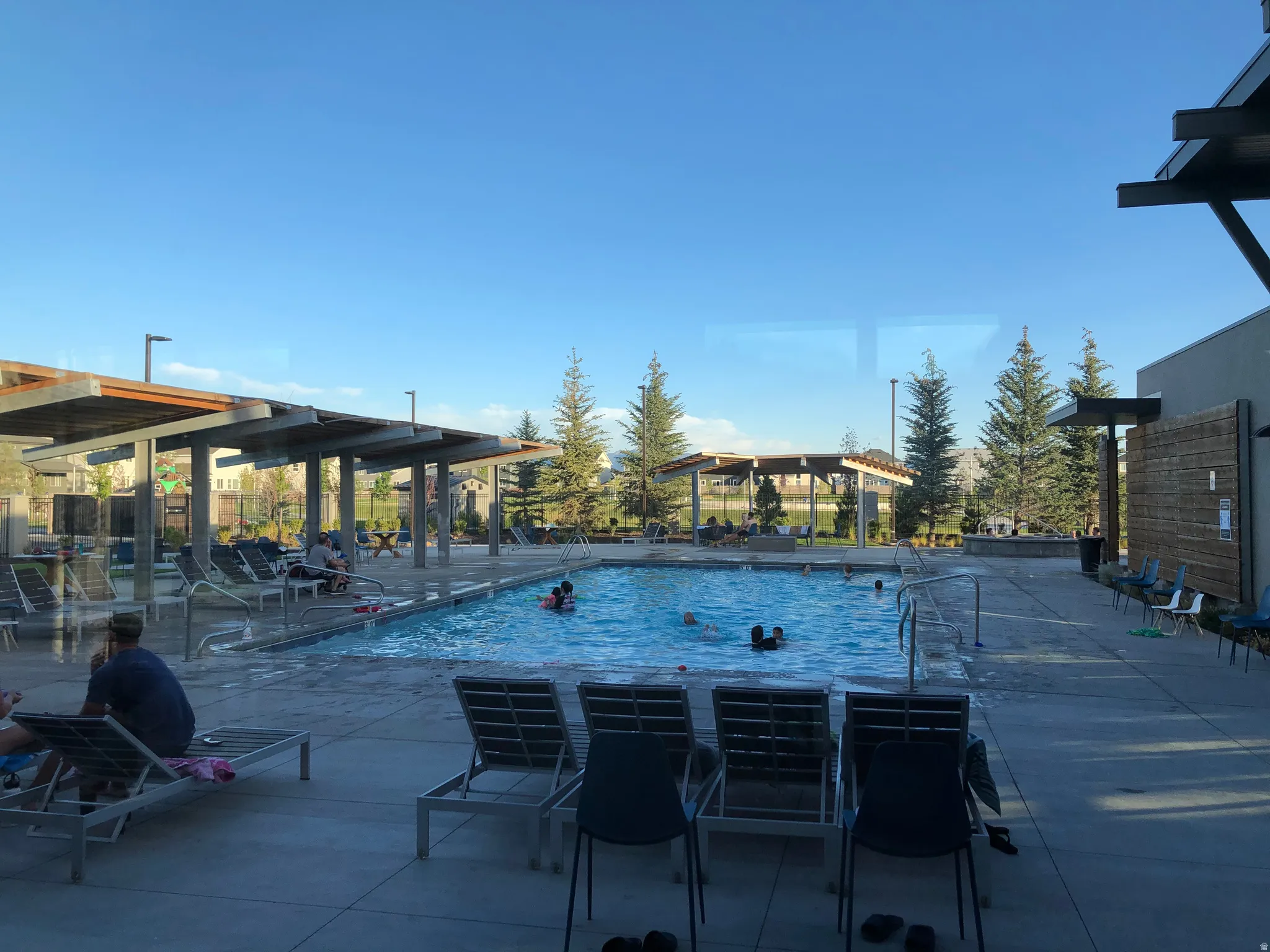 Community pool with a patio area
