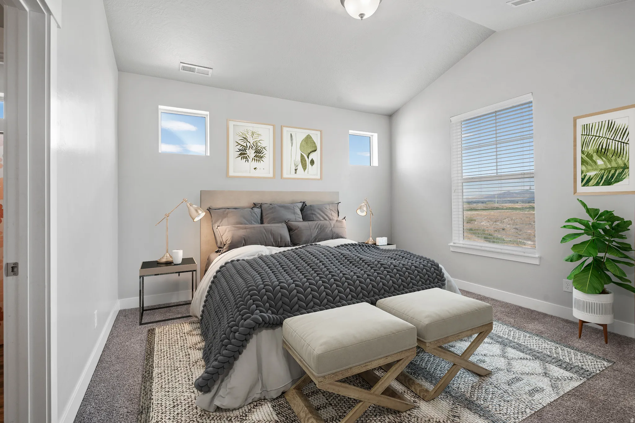 Bedroom featuring vaulted ceiling and carpet floors