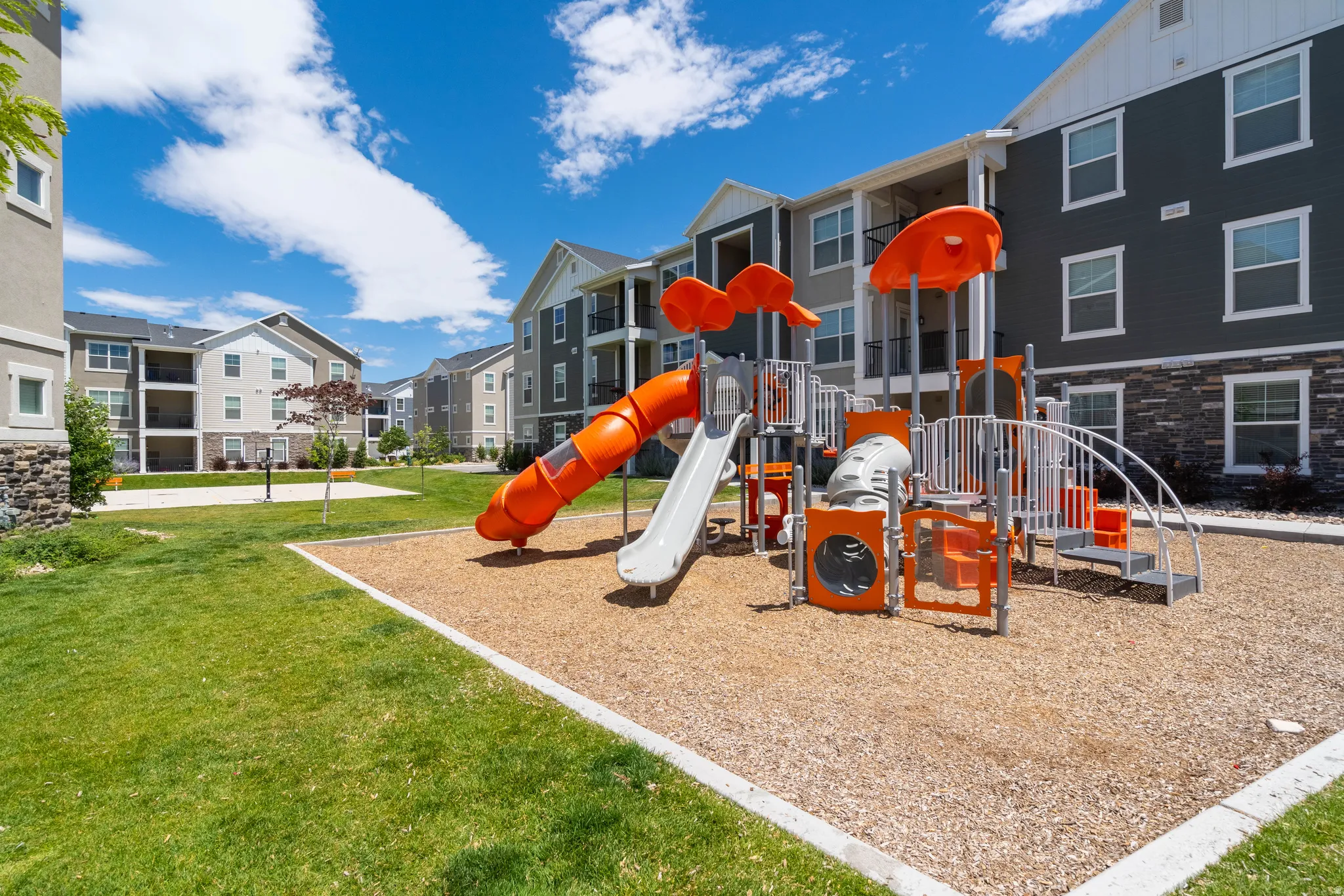 Community jungle gym featuring a yard