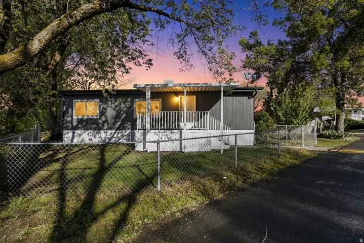 View of front facade featuring a fenced front yard