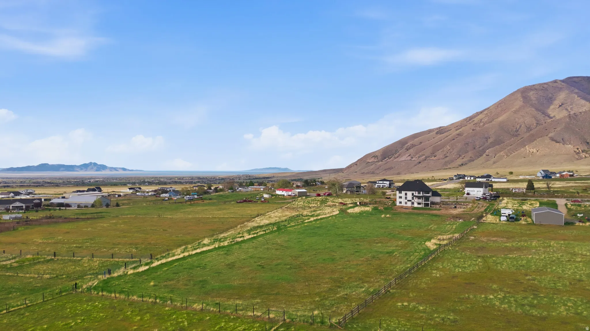 View of mountain backdrop featuring rural landscape and a pastoral area