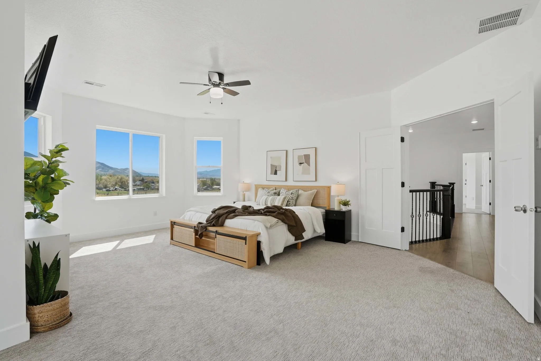 Master Bedroom featuring light colored carpet and a ceiling fan