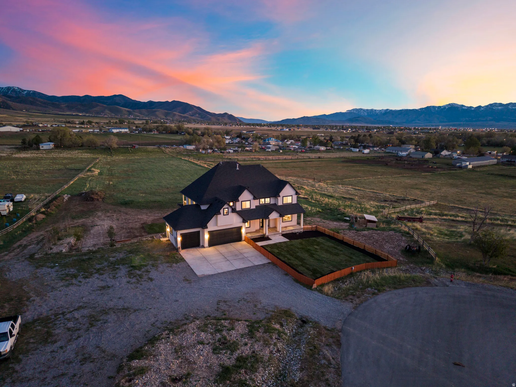 Aerial view at dusk of a view of rural / pastoral area and a mountain view