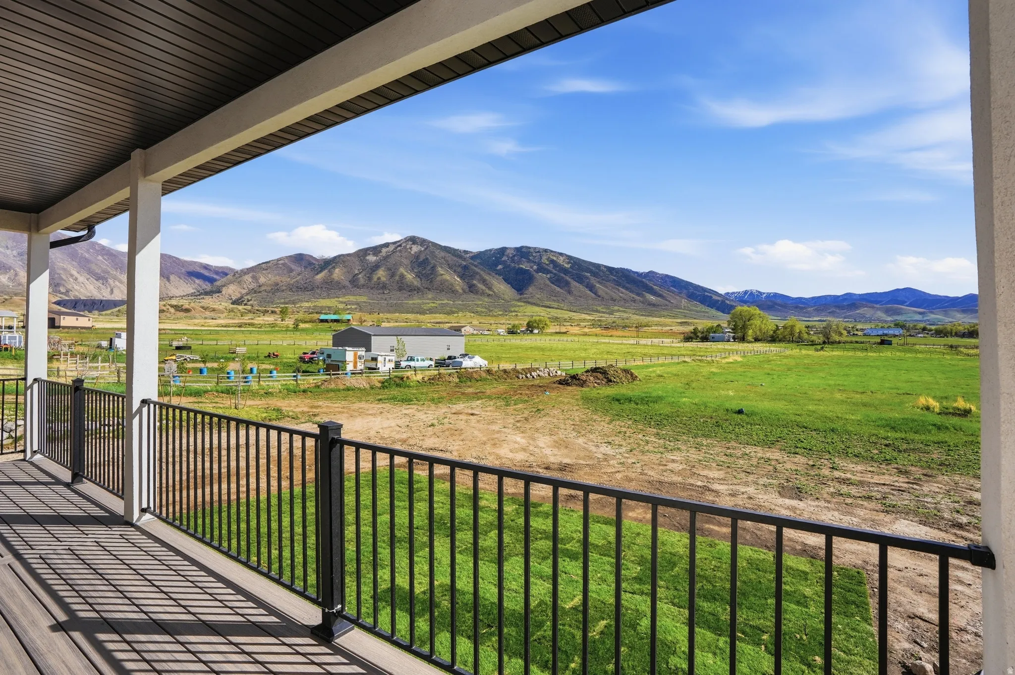 South West Facing View! Balcony with a rural view and a mountain view