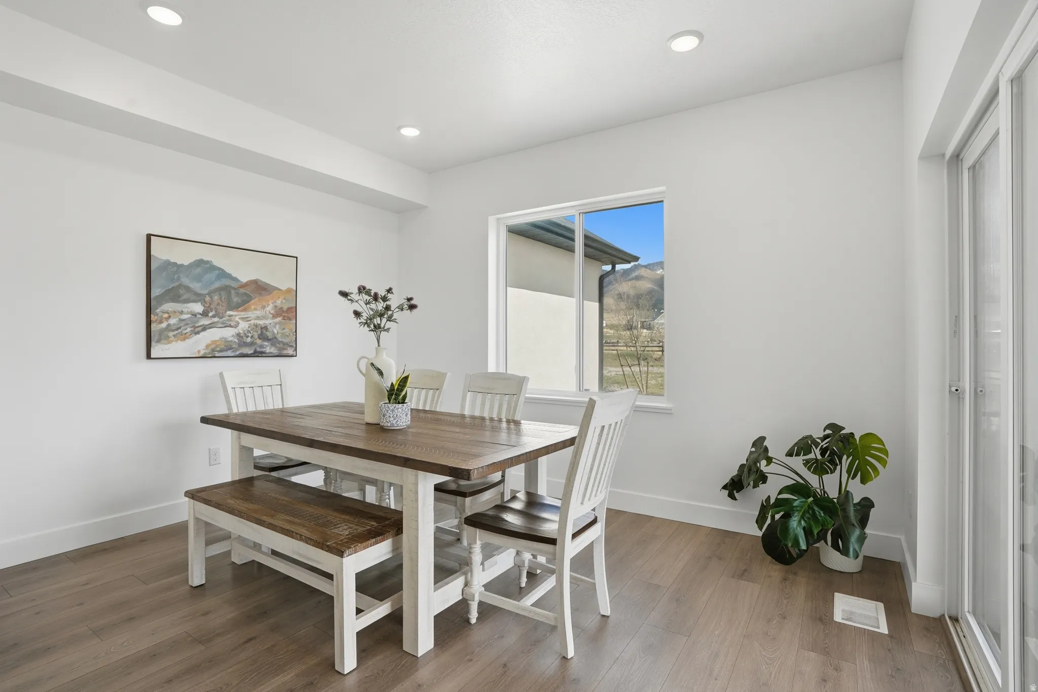 Informal Dining space featuring light wood-type flooring and recessed lighting