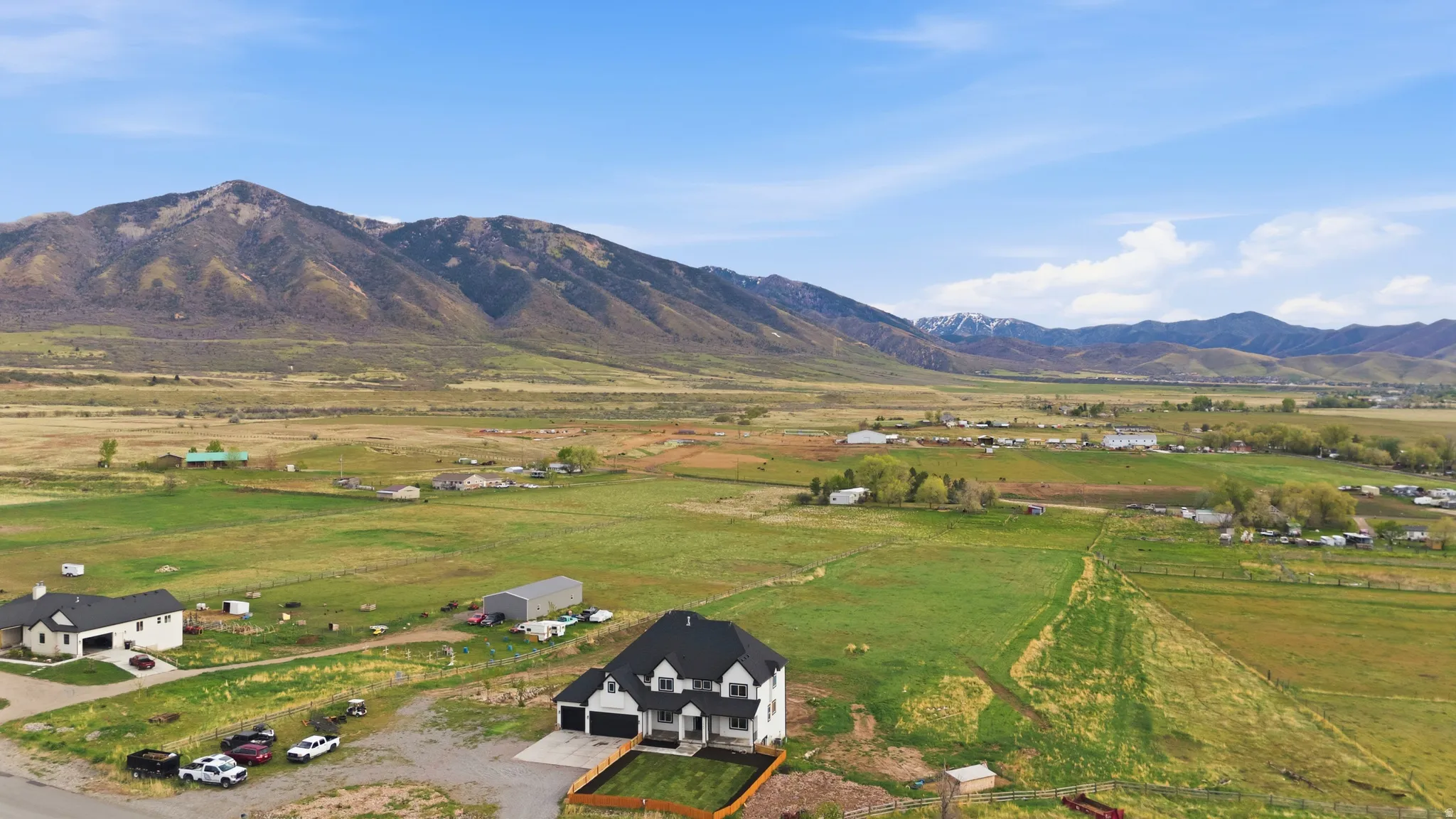 View of mountain background with rural landscape and agricultural land