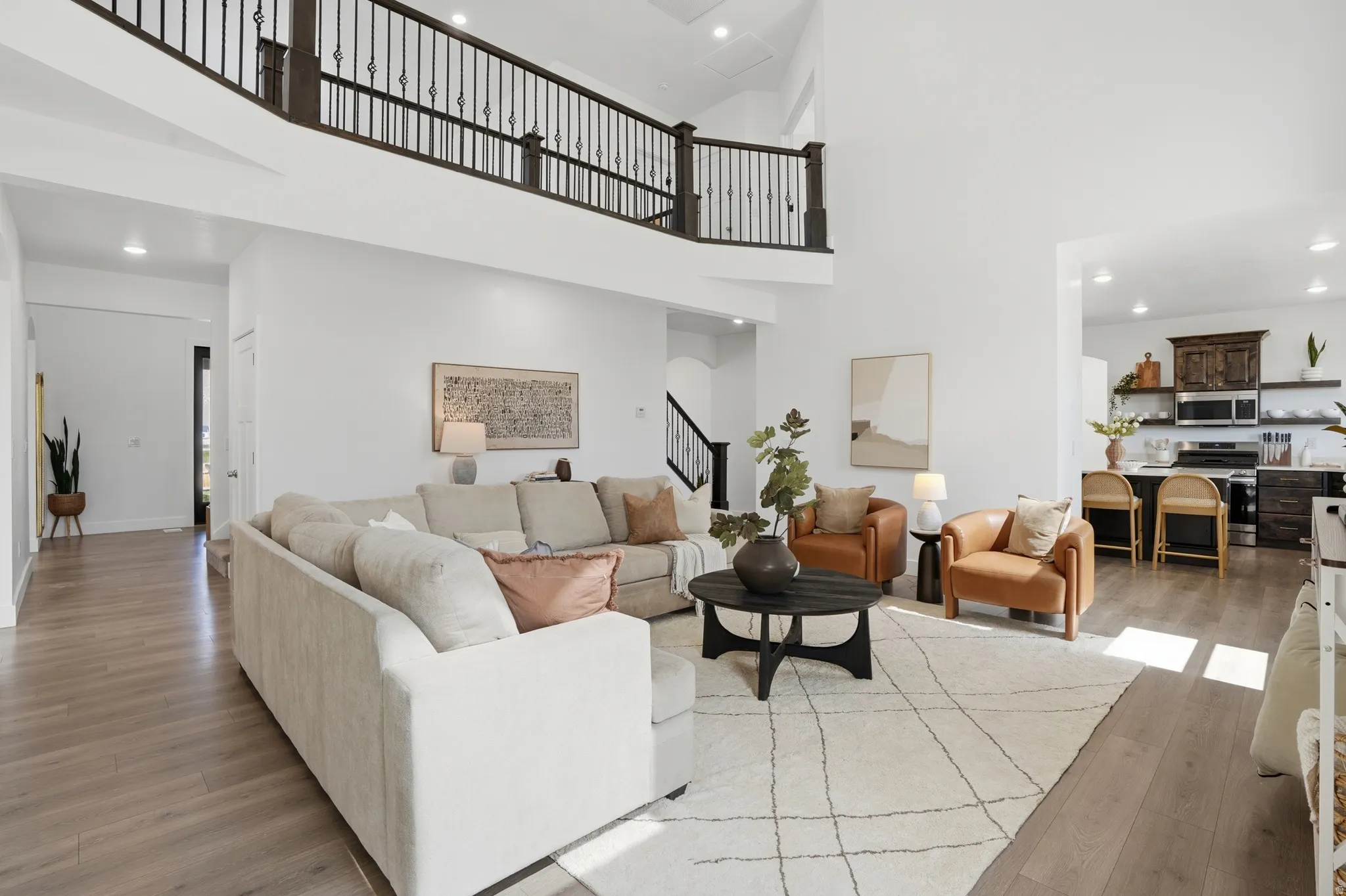 Living area with recessed lighting and light wood finished floors
