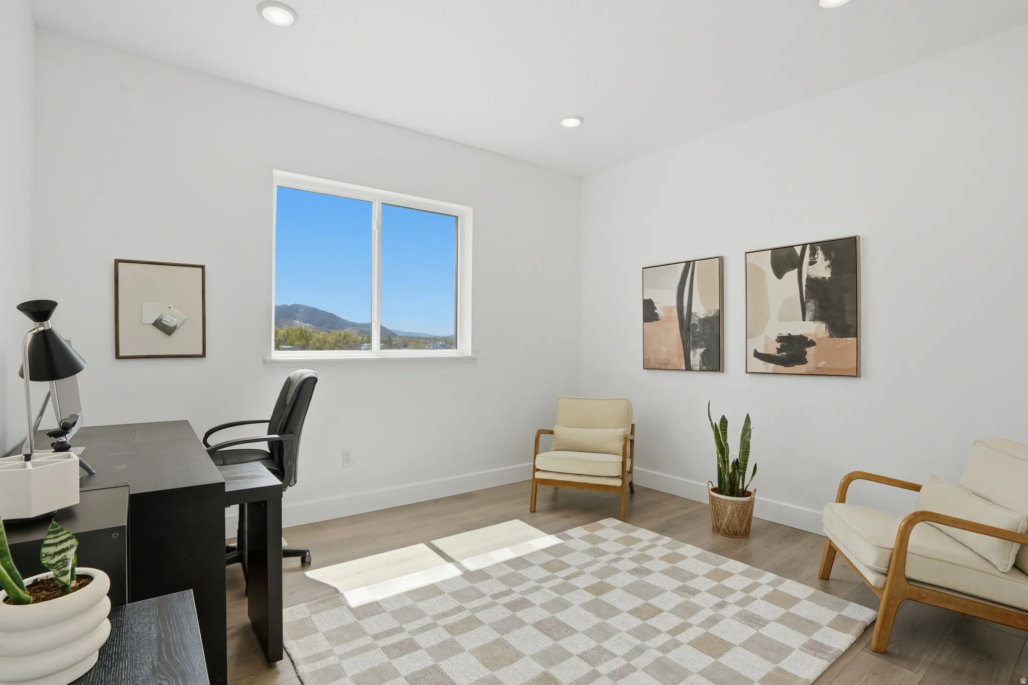 Bedroom 1 or Office space featuring light wood finished floors, recessed lighting, and a mountain view