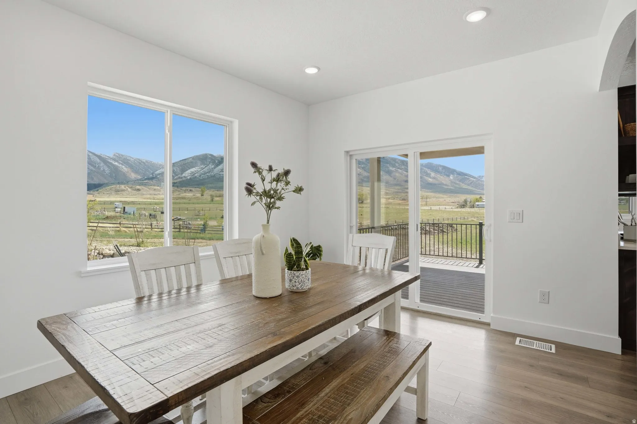 Informal Dining space featuring a mountain view, light wood-style floors, and recessed lighting