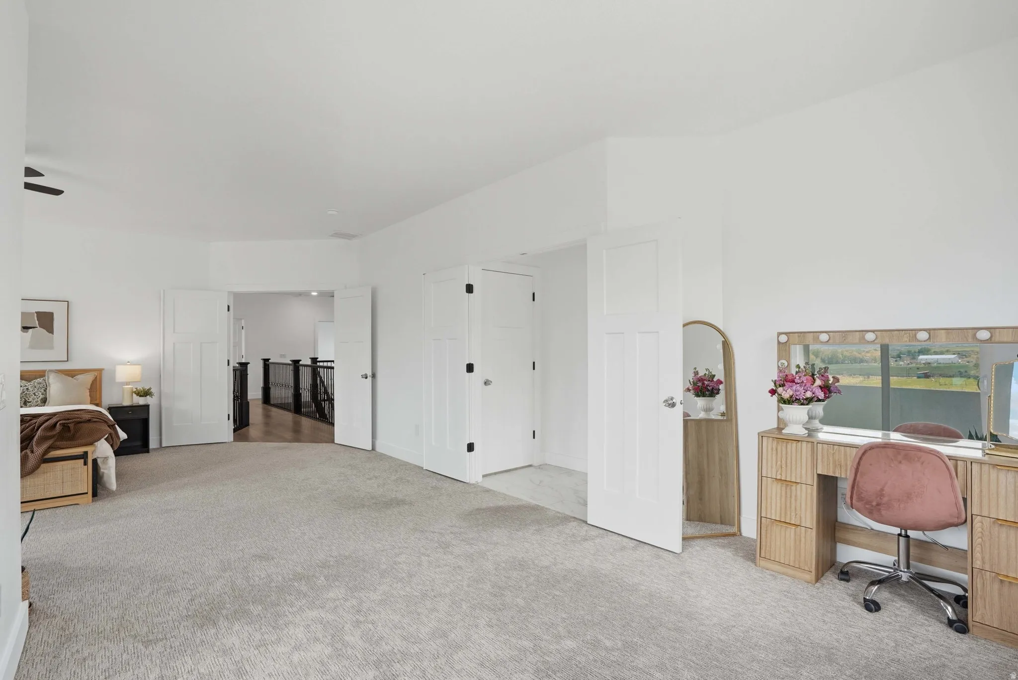 Master Bedroom featuring an office area and light colored carpet