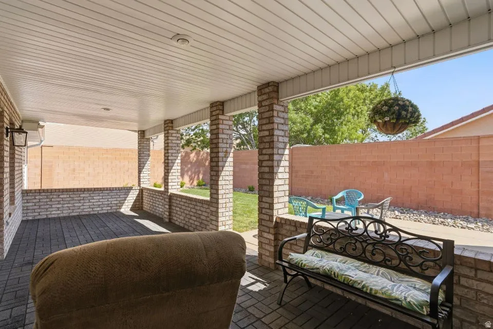 Fenced backyard featuring a patio