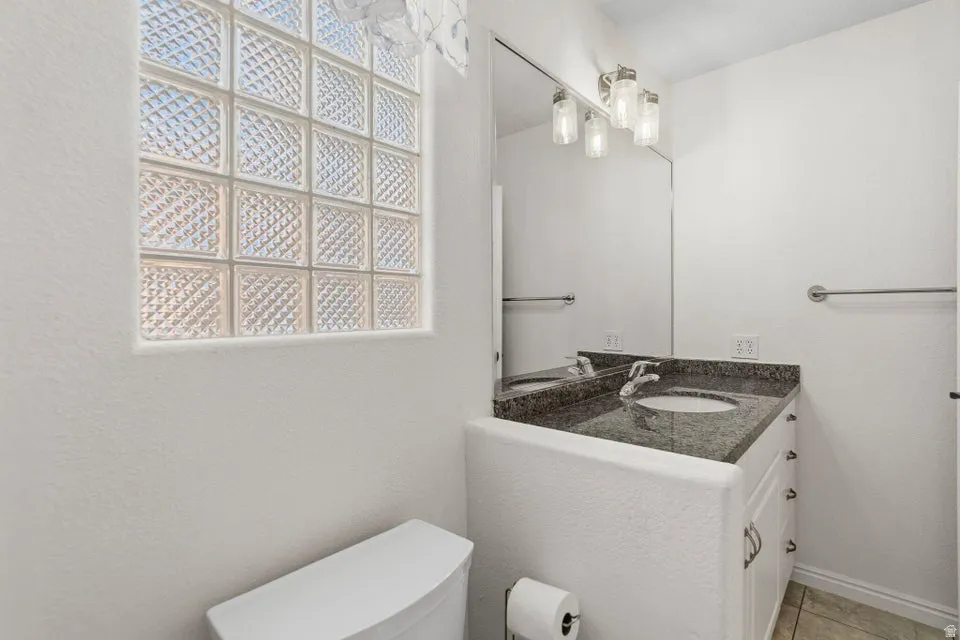Bathroom with vanity and toilet