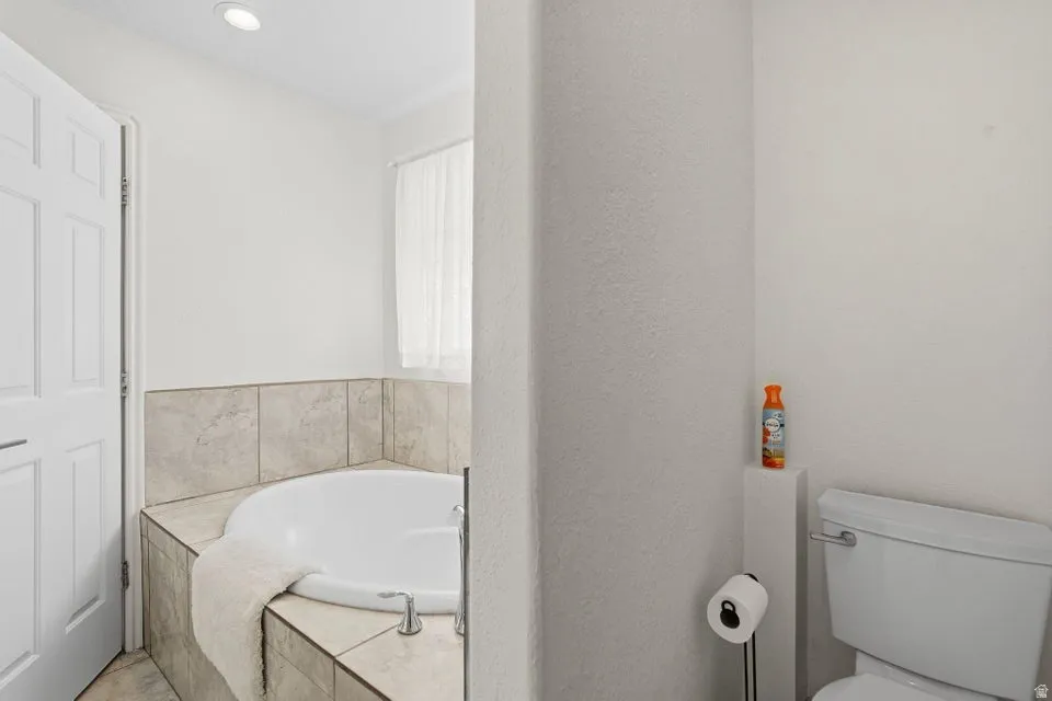 Bathroom with a bath and toilet