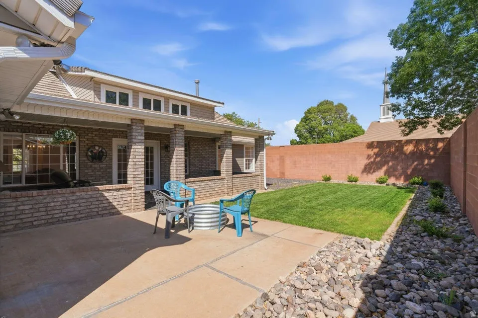 Fenced backyard with a patio area