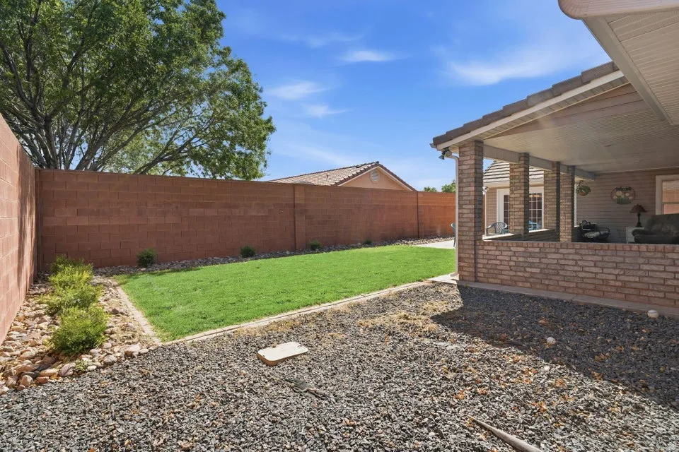Fenced backyard with a patio
